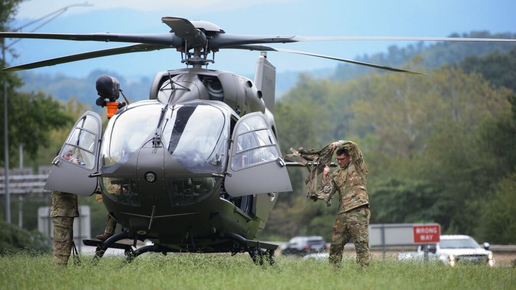 Helicopter with military personnel